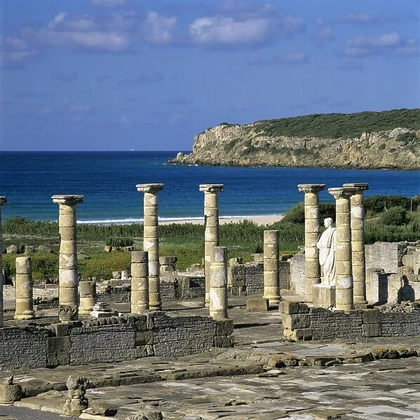 Roman ruins with statue of Emperor Trajan, Baelo Claudia, near Tarifa, Andalucia, Spain, Europe