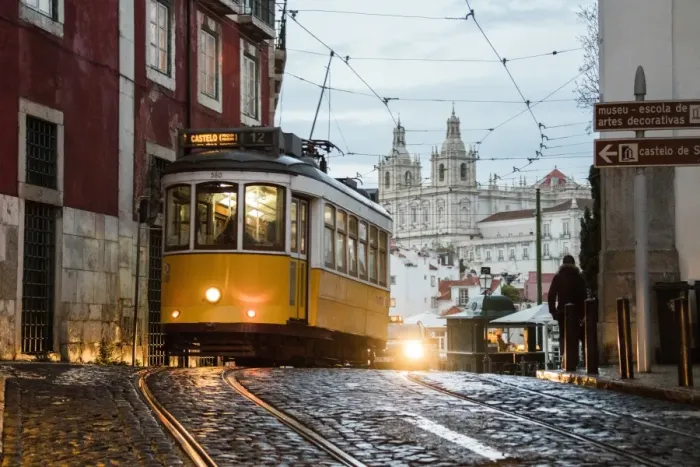 Framed Print : Romantic atmosphere in the old streets of Alfama with the castle in the background