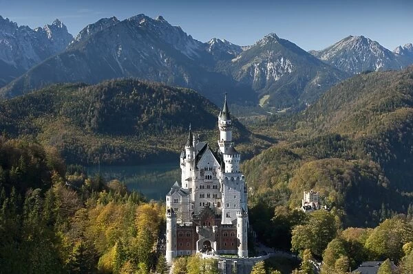 Romantic Neuschwanstein Castle and German Alps in autumn, southern part of Romantic Road