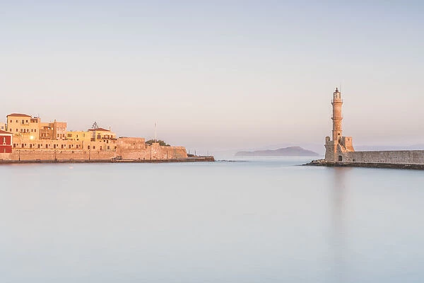 Romantic sky at dawn over the old fortress and lighthouse, Chania, Crete, Greek Islands