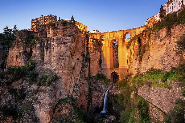 Ronda view with beautiful bridge and waterfall and traditional white village of Pueblos Blancos region, Andalusia, Spain, Europe