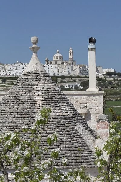 Roof of traditional trullo with Locorotondo in distance, Puglia, Italy, Europe