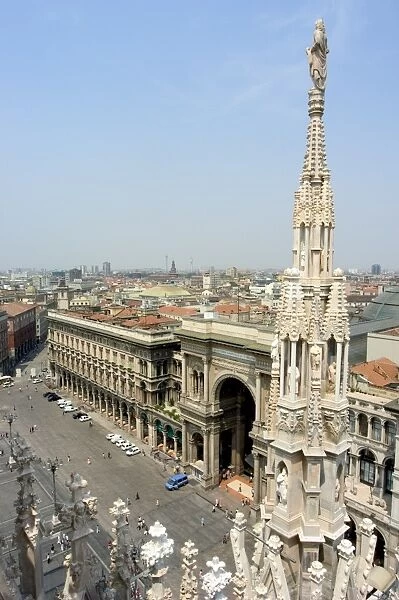 Rooftop spire of Duomo Cathedral and city