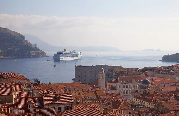 Rooftops, cruise ship and the island of Lokrum from Dubrovnik Old Town walls, Dubrovnik, Croatia, Europe