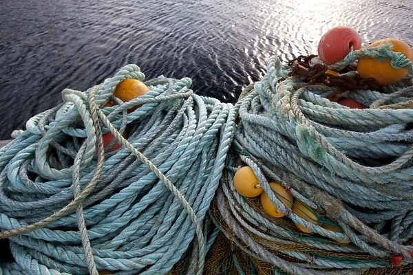 Ropes, fishing nets and floats on the quay in the harbour of Sto village