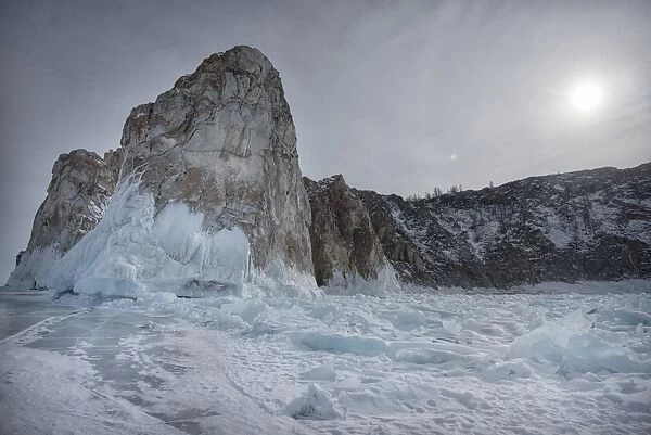 Rough ice formed at Shaman Rock, Olkhon Island as the waves freeze at the beginning of winter, Lake Baikal, Irkutsk Oblast, Siberia, Russia, Eurasia