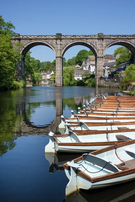 Framed Print : Row boats for hire in front of the Railway Viaduct over the river Nidd in Knaresborogh, Yorkshire, United Kingdom Framed Print : Row boats for hire in front of the Railway Viaduct over the river Nidd in Knaresborogh, Yorkshire, United Kingdom
