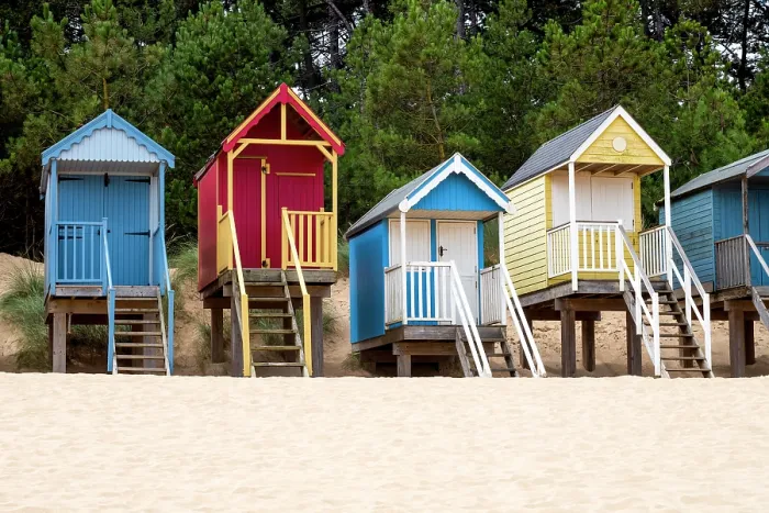 Framed Print : A row of colourful beach huts on the sand at Wells next the Sea in North Norfolk, United Kingdom Framed Print : A row of colourful beach huts on the sand at Wells next the Sea in North Norfolk, United Kingdom