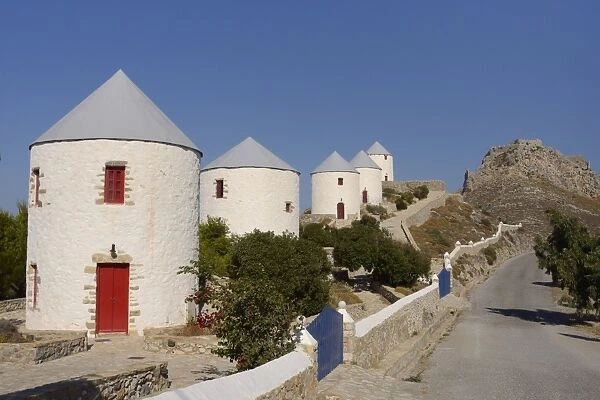 Row of old windmills on Pitiki Hill below Panteli castle, Platanos, Leros, Dodecanese Islands