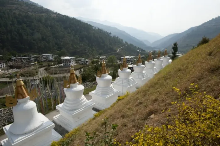 Framed Print : Row of white chortens at the entrance to Rangjung Buddhist monastery in the beautiful Framed Print : Row of white chortens at the entrance to Rangjung Buddhist monastery in the beautiful