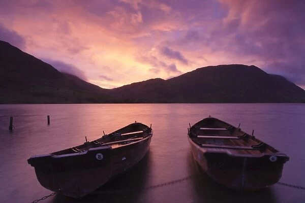 Rowing boats on Crummock Water at sunset, Lake District National Park, Cumbria, England, United Kingdom, Europe