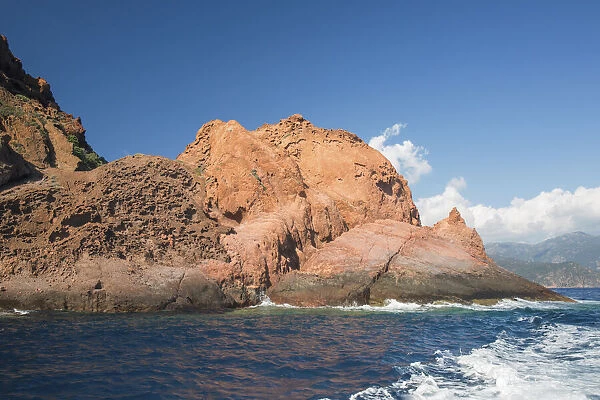 The rugged red cliffs of Punta Rossa, part of the Scandola Nature Reserve, UNESCO World Heritage Site, Porto, Corse-du-Sud, Corsica, France, Mediterranean, Europe