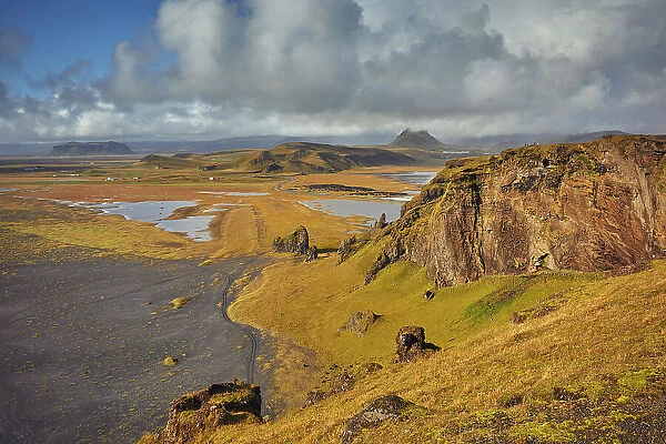 A rugged rocky and watery landscape around Dyrholaey Island, near the town of Vik, southern Iceland, Polar Regions