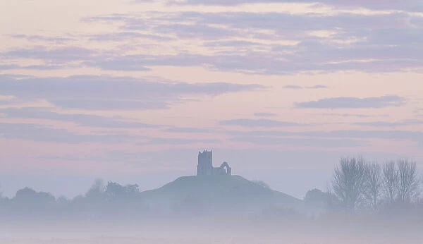 The ruined church of St. Michael on Burrow Mump, rising above the Somerset Levels at dawn on a frosty, misty morning, Burrowbridge, Somerset, England, United Kingdom, Europe
