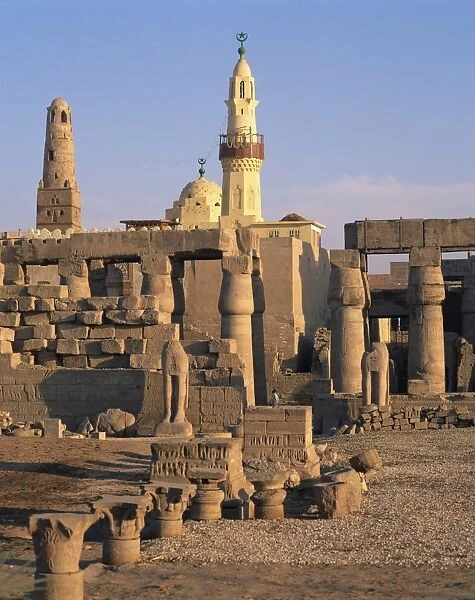 Ruins of the Luxor Temple, and the minaret of the Abu el Haggag Mosque built in the middle