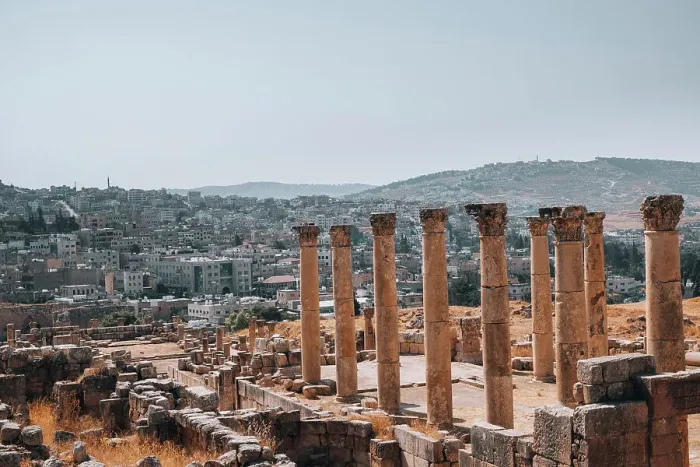 Framed Print : The ruins of a Roman temple, with the modern city of Jerash in the background, Jerash, Jordan, Middle East Framed Print : The ruins of a Roman temple, with the modern city of Jerash in the background, Jerash, Jordan, Middle East