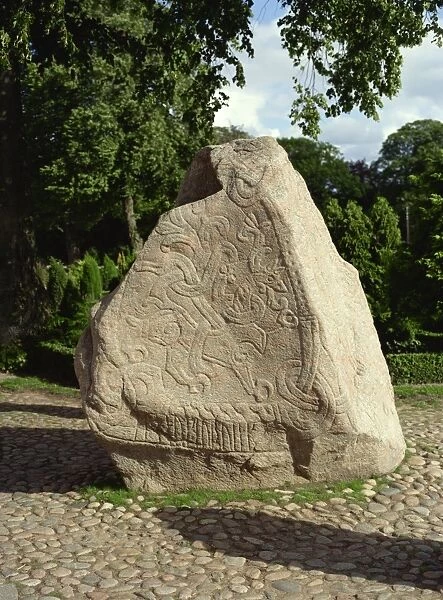 Rune stone referring to burials of Harald Blue Tooth, in Jelling churchyard