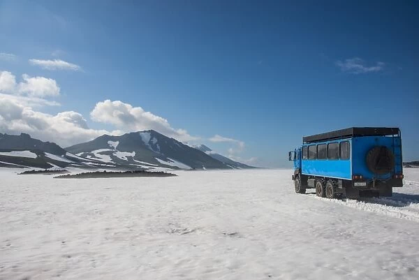Russian truck crossing a snowfield, Mutnovsky volcano, Kamchatka, Russia, Eurasia