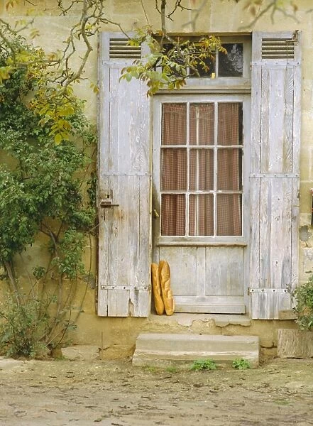 Rustic door and bread, Aquitaine, France, Europe