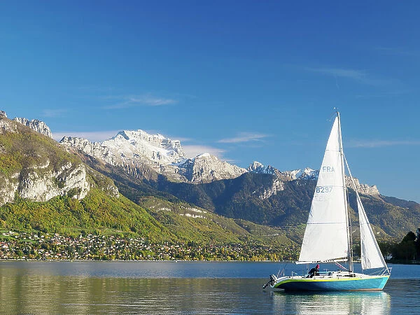 A sailboat on Lake Annecy on a beautiful late-fall day, Annecy, Haute-Savoie, France, Europe