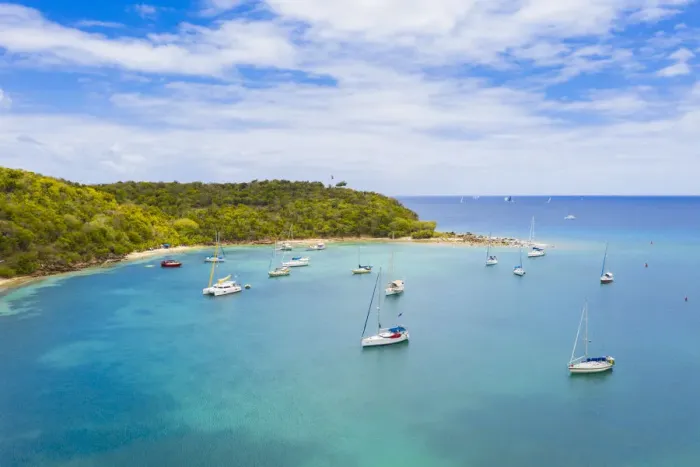 Framed Print : Sailboats and catamarans moored in a tropical bay, aerial view by drone, Caribbean Sea Framed Print : Sailboats and catamarans moored in a tropical bay, aerial view by drone, Caribbean Sea