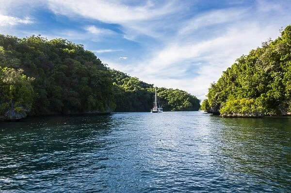 Sailing boat leaving the habour of Koror, Rock islands, Palau, Central Pacific, Pacific