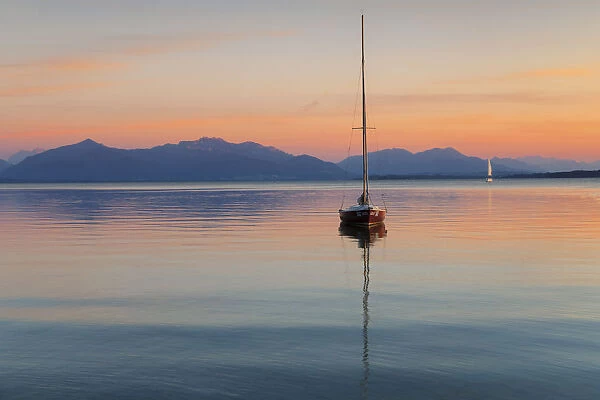 Sailing boat at sunset, Lake Chiemsee and Chiemgau Alps, Upper Bavaria, Germany, Europe