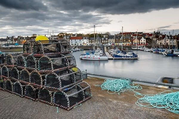 Sailing boats and crab pots at dusk in the harbour at Anstruther, Fife, East Neuk