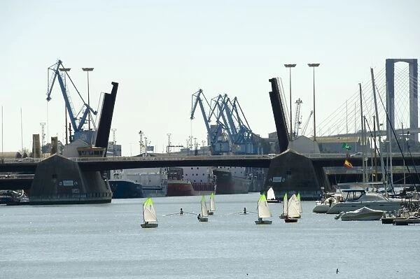 Sailing boats and Seville harbour on the river Rio Guadalquivir