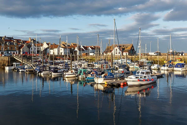 Sailing boats at sunset in the harbour at Anstruther, Fife, East Neuk, Scotland, United Kingdom