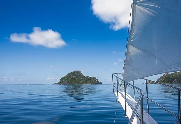 Sailing in the very flat waters of the Mamanuca Islands, Fiji, South Pacific