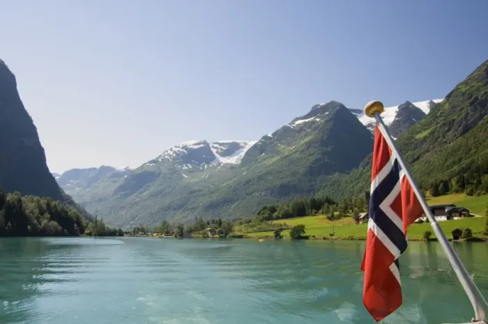 Framed Print : Sailing on the green lake and Norwegian flag, Olden, Fjordland, Norway Framed Print : Sailing on the green lake and Norwegian flag, Olden, Fjordland, Norway