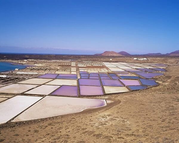 Salt pans and volcanoes in the background, near Yaiza, Lanzarote, Canary Islands