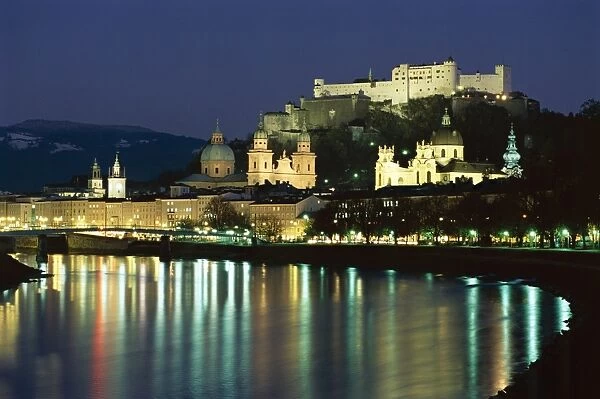 Salzach River and domes of Cathedral and Kollegenkirche, at night, Salzburg