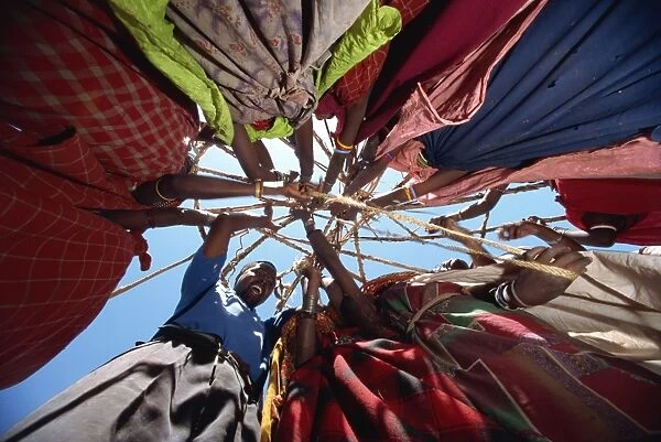 Samburu women setting up camp, Loodua, Kenya, East Africa, Africa