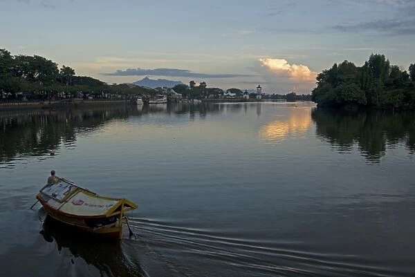 Sampan ferry on the Sarawak River in the centre of Kuching city at sunset