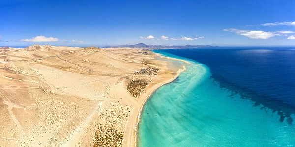 Sand beach of Costa Calma washed by turquoise sea, aerial view, Jandia Nature Park