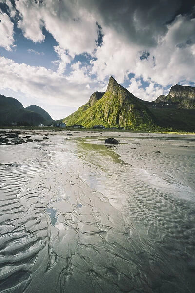 Empty sand beach with majestic Hatten mountain in the background, Ersfjord, Senja island