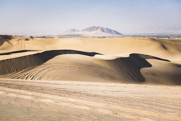 Sand dunes in the desert at Huacachina, Ica Region, Peru, South America