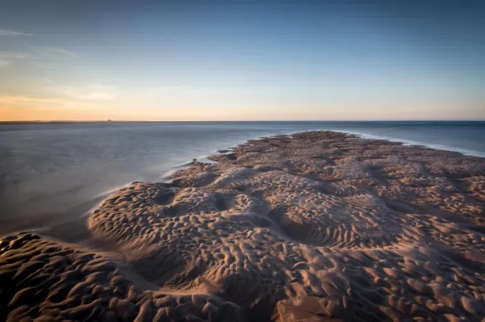 Framed Print : Sand formations at Budle Bay, with Holy Island Castle in the distance, Northumberland Framed Print : Sand formations at Budle Bay, with Holy Island Castle in the distance, Northumberland