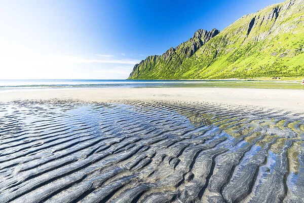 Sand modeled by wind on the empty Ersfjord beach, Senja, Troms county, Norway