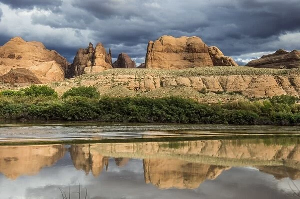 Sandstone rocks reflecting in the Colorado River, Canyonlands National Park, Utah, United States of America, North America