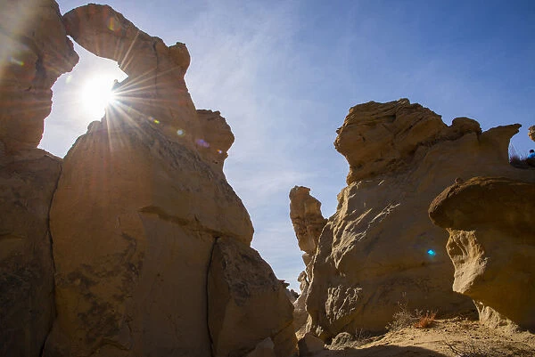 Sandstone sculptures and sun flare in Bisti  /  De-Na-Zin Wilderness in New Mexico