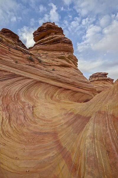 Sandstone wave and cones under clouds, Coyote Buttes Wilderness, Vermilion Cliffs National Monument