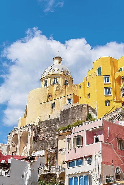 Santa Maria delle Grazie church among colourful houses in the fishing village of Marina Corricella, Procida island, Naples Bay, Phlegraean Islands, Naples province, Campania, Italy, Europe