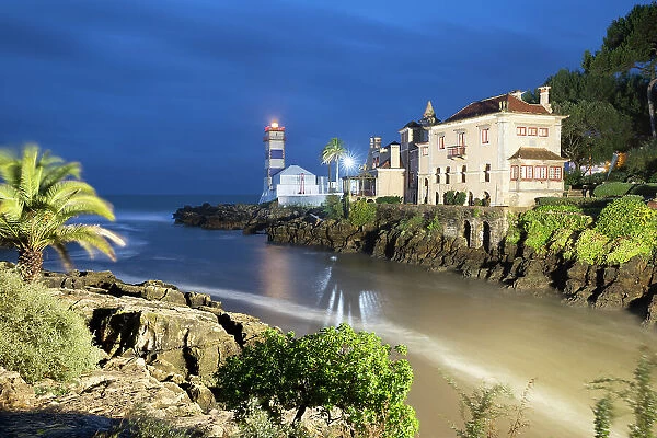 Santa Marta Lighthouse Museum and Casa Museu de Santa Maria floodlit at dawn, Cascais, Lisbon Region, Portugal, Europe