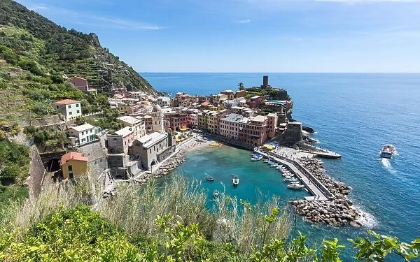 A scenic lookout over the harbour and old town of Vernazza, Cinque Terre, UNESCO