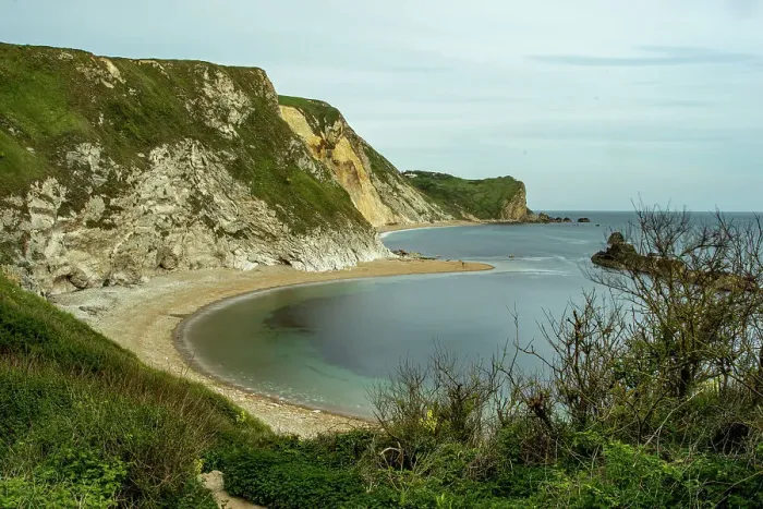 Framed Print : Scenic view of a tranquil cove with a sandy beach, surrounded by rugged cliffs under a clear blue sky at Durdle Door, Jurassic Coast, UNESCO World Heritage Site, Dorset, England, United Kingdom, Europe Framed Print : Scenic view of a tranquil cove with a sandy beach, surrounded by rugged cliffs under a clear blue sky at Durdle Door, Jurassic Coast, UNESCO World Heritage Site, Dorset, England, United Kingdom, Europe