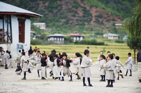 School children playing, Paro, Bhutan, Asia