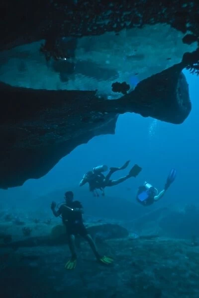Scuba divers in underwater cave, Southern Thailand, Andaman Sea, Indian Ocean, Asia